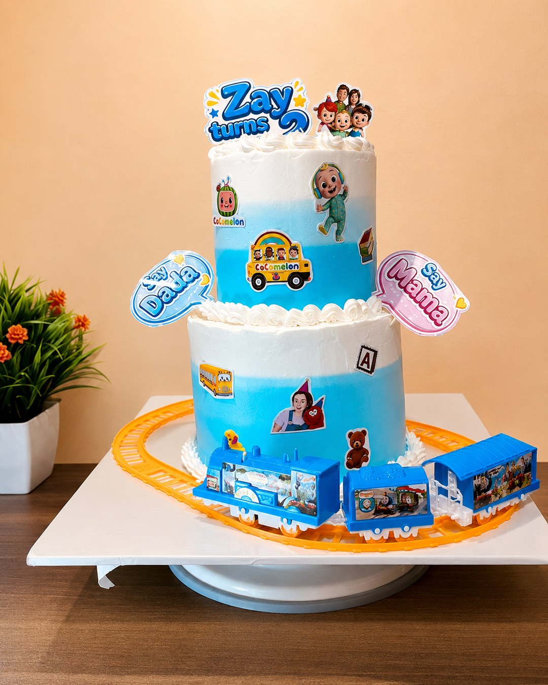 Blue and white two-tier baby celebration cake design in Nairobi