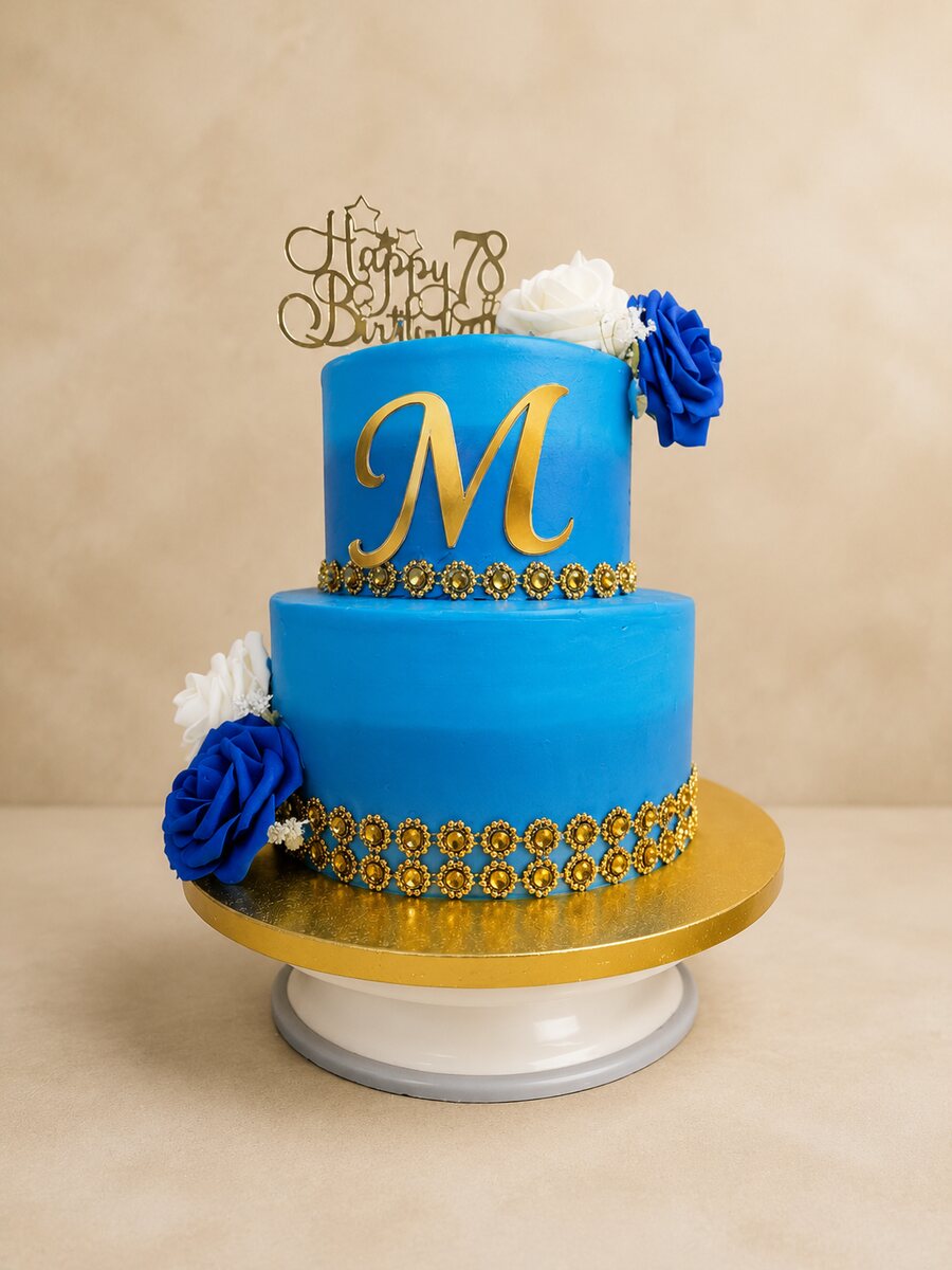 Blue and gold celebration cake by Moh Bakes in Nairobi