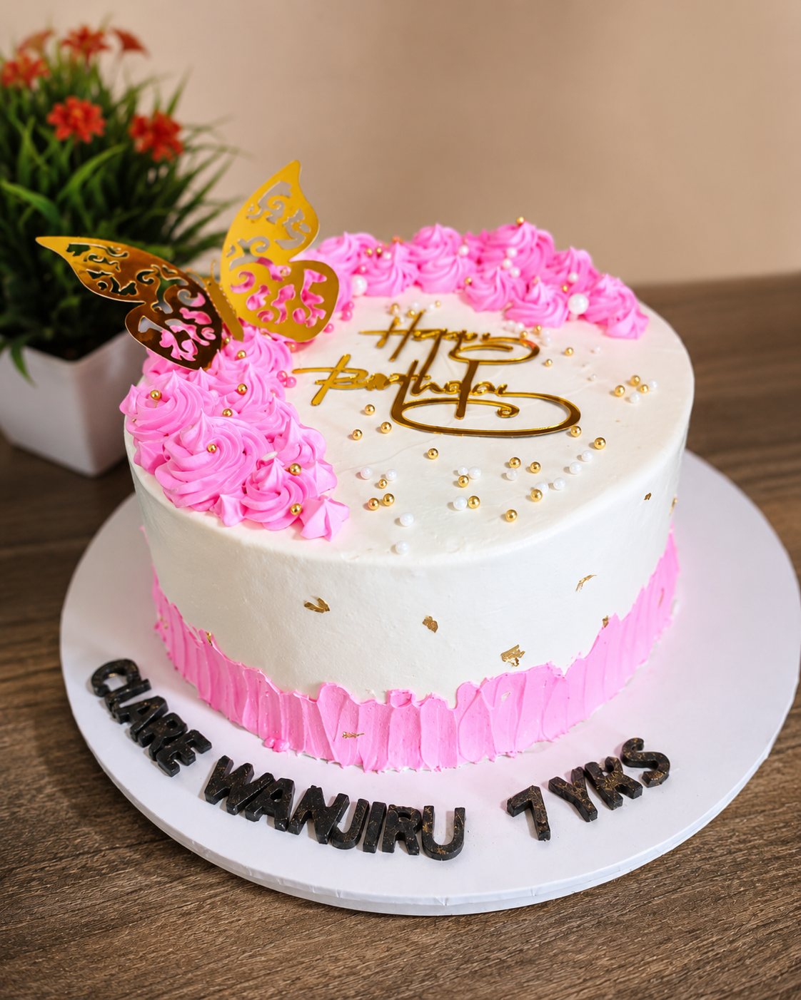 Pink butterfly custom cake by Moh Bakes for Nairobi customers