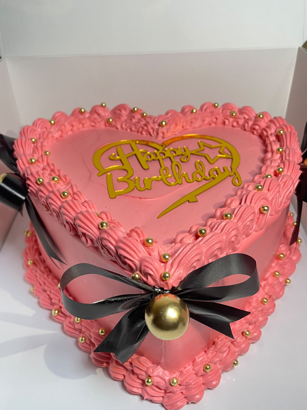 Pink heart ribbon birthday cake made by Moh Bakes & Treats